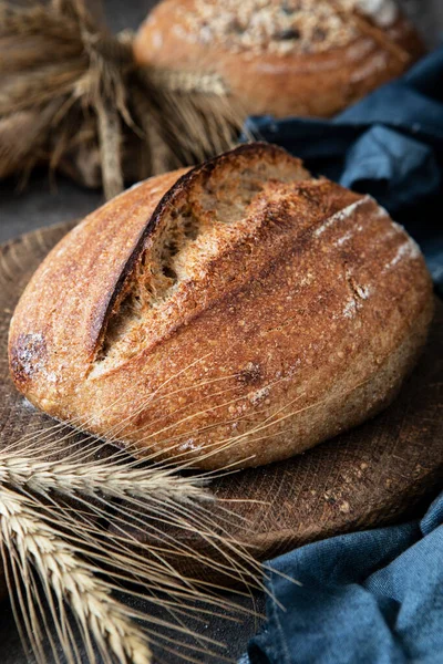 Fresh  whole grain bread. Healthy baked bread on wooden board