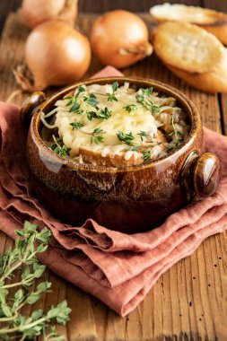 Traditional French onion soup, with croutons,  cheese, thyme