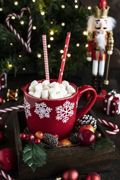 Cup of creamy hot chocolate with melted marshmallows    for christmas holiday , close-up with selective focus, shallow depth of field