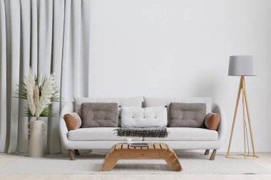 big white living room.interior design,white  sofa,wooden table,floral in vase,lamp,carpet ,wall for mock up and copy space