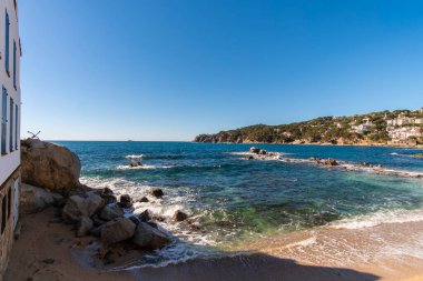 Beautiful seascape on the quiet waters of Mediterranean Sea shore in a beautiful beach in Costa Brava, Catalonia clipart