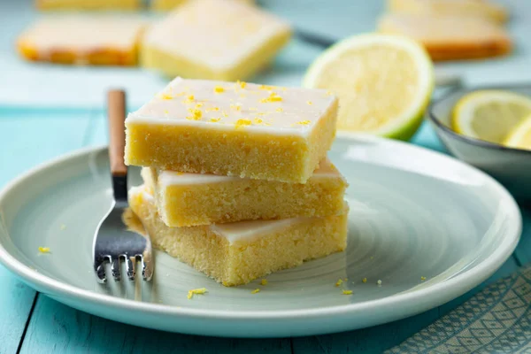 Fudgy Lemon Brownies Lemon Glaze Zest Aquamarine Dish — Stock Photo, Image