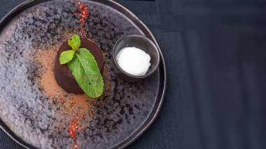 lava cake. Chocolate fondant with basil ganache. Traditional dessert of French cuisine with author's filling.