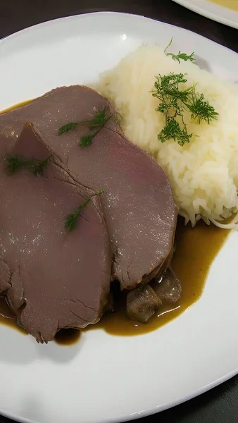 a cuisine photo of a dish of lamb