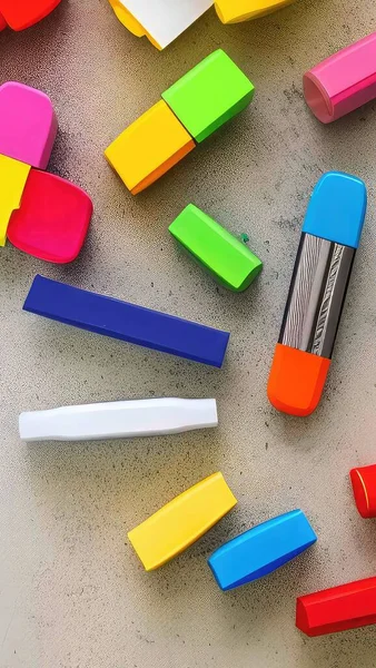colorful markers on a white background