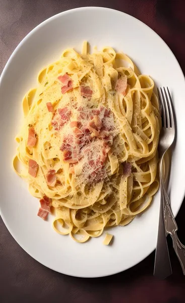 pasta with bacon and cheese on white plate