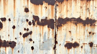 Paslanmış çelik yüzey dokusu arkaplanının bir fotoğrafı.