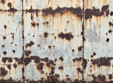 Paslanmış çelik yüzey dokusu arkaplanının bir fotoğrafı.