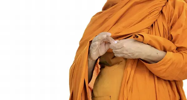 a photography of a monk in a yellow robe holding a banana, monk in orange robe holding a banana in his hands.