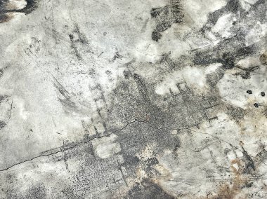 Ortasında bir delik olan kirli beton bir duvarın, ortasında bir delik olan beton bir duvarın fotoğrafı..