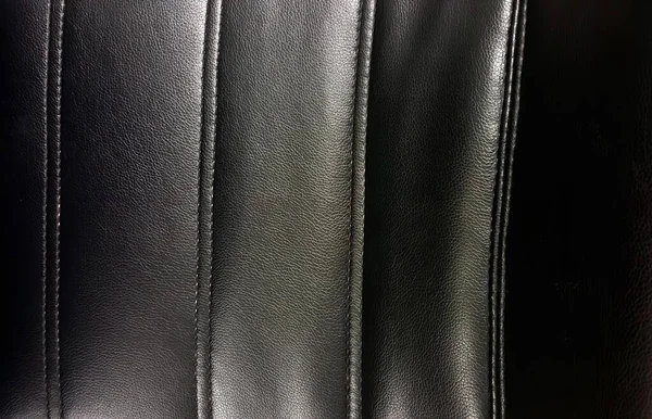 一张黑色皮革座椅的特写照片 一张有针迹图案的黑色皮革座椅的特写照片 — 图库照片