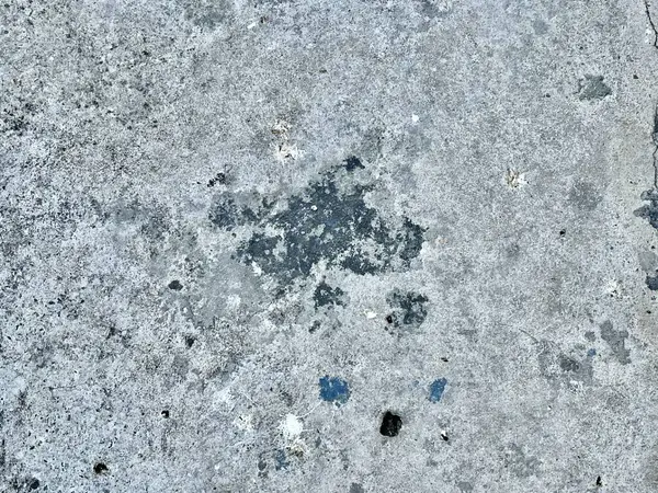 Uma Fotografia Uma Superfície Cimento Com Monte Pequenos Furos Tampa — Fotografia de Stock