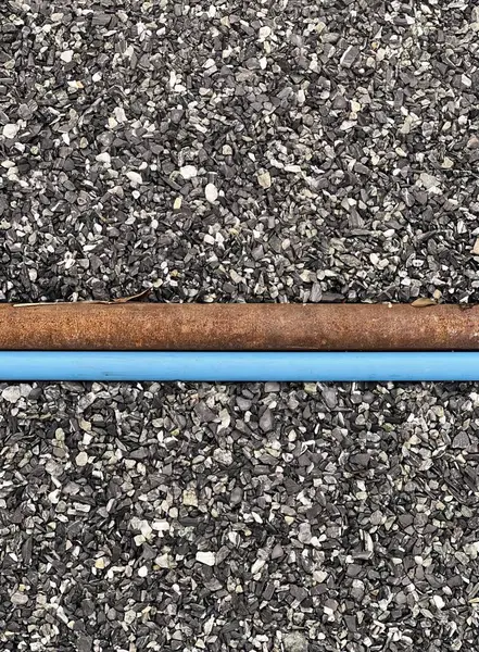 a pipe with a blue pipe on top of it..