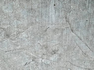 Çimento duvar deseni çizikler ve haç deseni var..