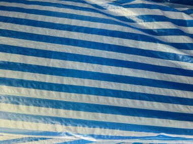 a photography of a blue and white striped sheet with a white stripe. clipart
