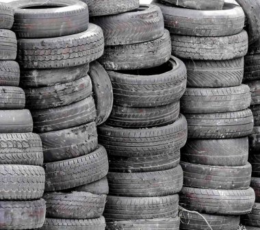 a photography of a pile of tires sitting on top of each other. clipart