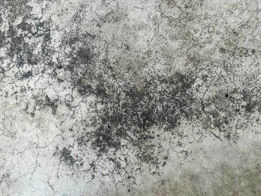 Siyah beyaz desenli kirli bir duvarın fotoğrafı..