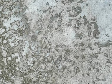 Kirli beton bir yüzey ve beyaz boya..