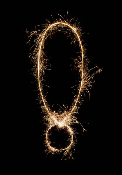 Sparkling burning creative symbol ! isolated on black background. Beautiful glowing golden overlay object for design holiday greeting card. Creative lettering symbol ! written with burning sparklers