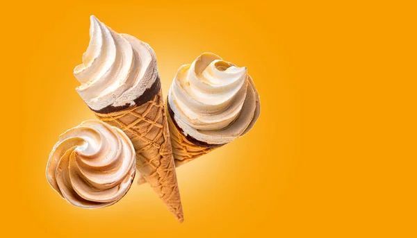Three waffle cups with ice cream. Isolate on a yellow background