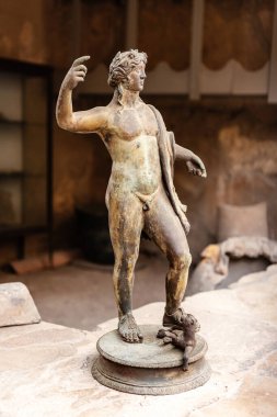 The ruins of the ancient city of Herculaneum, located at the foot of Mount Vesuvius. Ancient antique sculpture of a young man in the Museum of the ancient city Herculaneum clipart