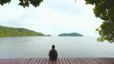 Man enjoying a peaceful view on the sea. High quality 4k footage