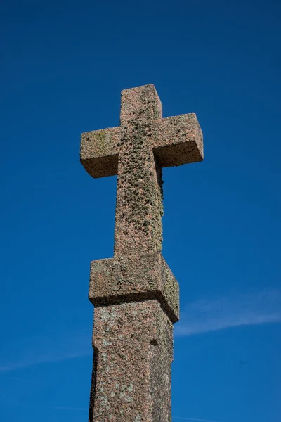 Christian cross in pink granite on the Cotes d\'Armor in Brittany