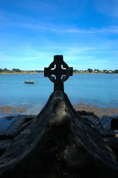 Celtic cross on the bay of the Etel river (Ria d\'Etel) Brittany, Morbihan