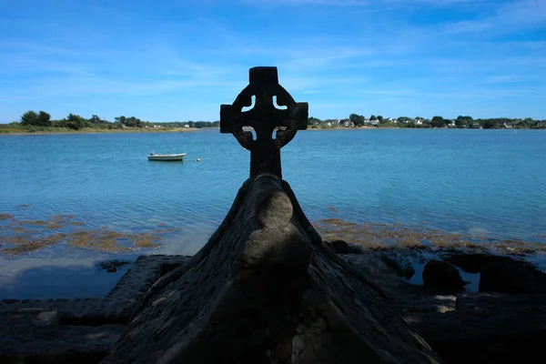 Celtic cross on the bay of the Etel river (Ria d'Etel) Brittany, Morbihan
