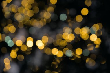 bright bubbles of yellow lights, abstract background, bokeh blur effect