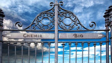 Almanca 'nın iki farklı yönünü gösteren işaret direği olan bir resim. Bir yön biyolojiyi, diğeri kimyayı gösteriyor..