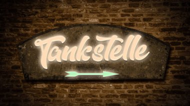 Benzin istasyonunu işaret eden Almanca işaret levhası olan bir resim..