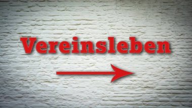 Almanca bir levhası olan bir resim, kulüp yaşamını işaret ediyor..