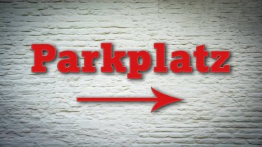 Otoparkı işaret eden Almanca işaret levhası olan bir resim..