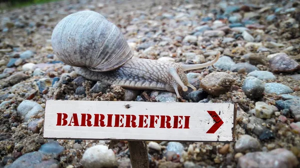 stock image the picture shows a signpost and a sign pointing in the direction of barrier-free in german