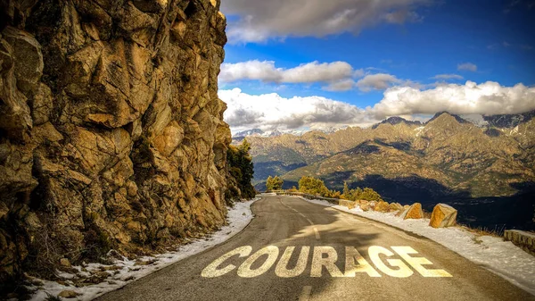 stock image the picture shows a signpost and a sign that points in the direction of courage in german.