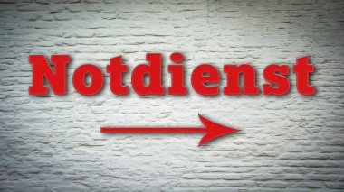 Almanca işaretli bir resim. Acil servis yönünü gösteriyor..