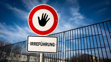 Almanca 'nın iki farklı yönünü gösteren işaret direği olan bir resim. Bir yön avukatı işaret eder, diğeri aldatmayı..