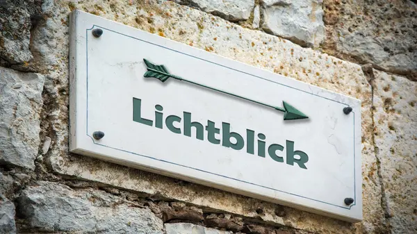 stock image a picture with signposts in the direction of a bright spot in German