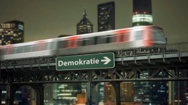 Resimde Almanca 'da demokrasi yönünü gösteren bir tabela ve işaret var..