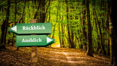 An image with a signpost pointing in two different directions in German. One direction points to outlook, the other points to backsight clipart