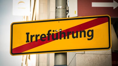 Almanca 'nın iki farklı yönünü gösteren işaret direği olan bir resim. Bir yön avukatı işaret eder, diğeri aldatmayı..