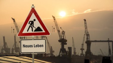 An image of a signpost in German pointing in the direction of New Life. clipart