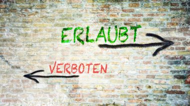 Almanca 'nın iki farklı yönünü gösteren işaret direği olan bir resim. Bir yön izin verileni, diğeri yasaklananı işaret ediyor.