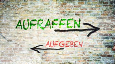 Almanca 'nın iki farklı yönünü gösteren işaret direği olan bir resim. Bir yön toparlanmayı, diğeri vazgeçmeyi işaret ediyor..