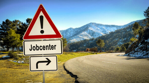 На рисунке показаны указатель и знак, указывающий в направлении центра занятости на немецком языке..