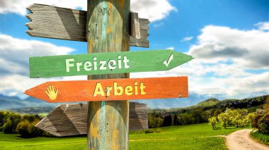 An image with a signpost pointing in two different directions in German. One direction points to free time, the other points to work. clipart