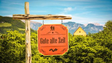 Resim bir tabela ve Almanca 'daki eski güzel günleri gösteren bir tabela gösteriyor..