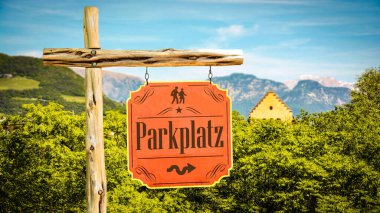 An image with a signpost in German pointing towards the parking lot. clipart