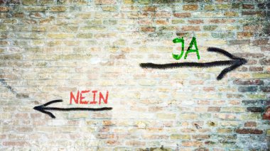 Almanca 'nın iki farklı yönünü gösteren işaret direği olan bir resim. Bir yön evet diyor, diğeri hayır..